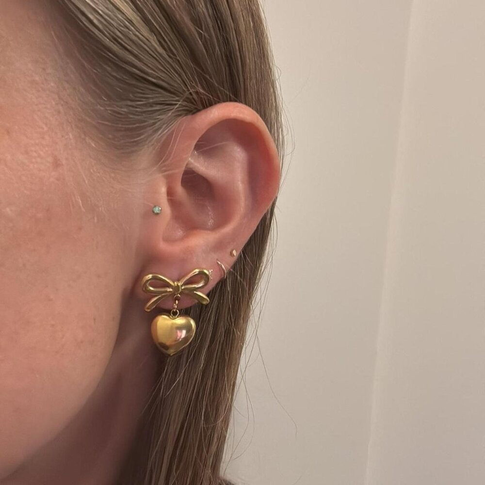 The Catherine gold heart bow dangling chunky hoops hoop earrings